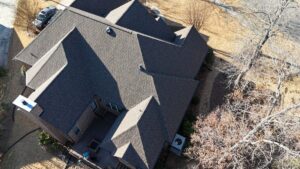Rock roofing and restoration brown shingles roof drone shoot