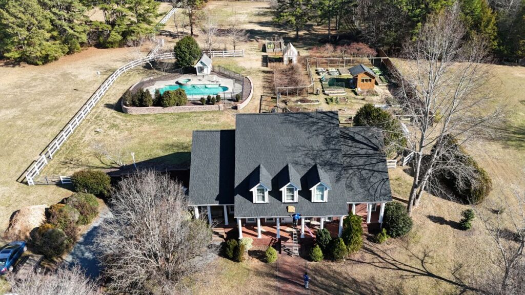Rock roofing and restoration roof replacement workers on roof