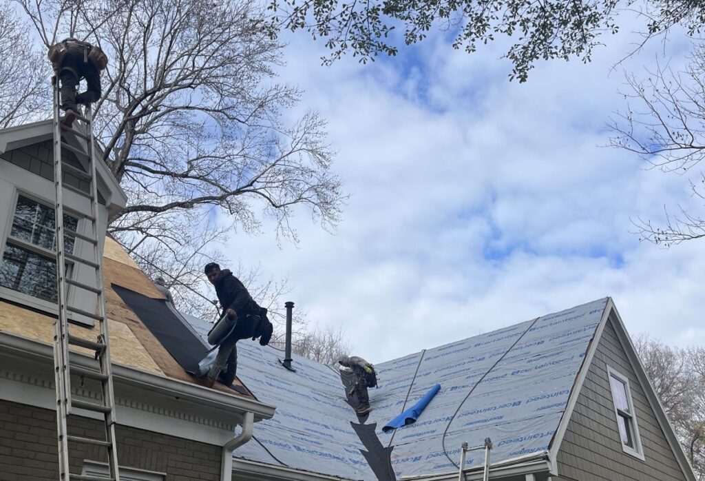 Rock Roofing team on a roof