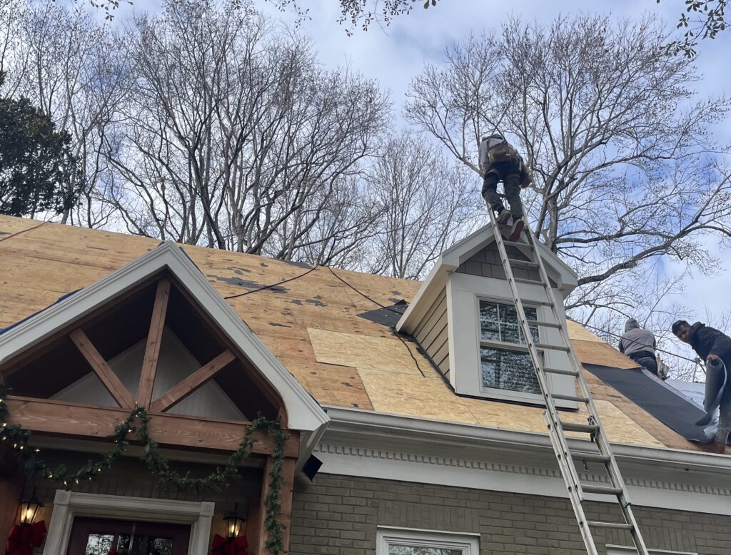 Roofer on a ladder