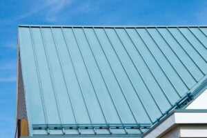 cost of metal roof vs shingle blue metallic white wall blue sky snow guards