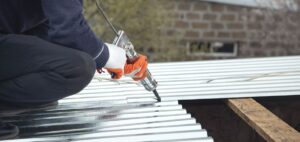 roof sealant gloves using gun to seal metallic roof