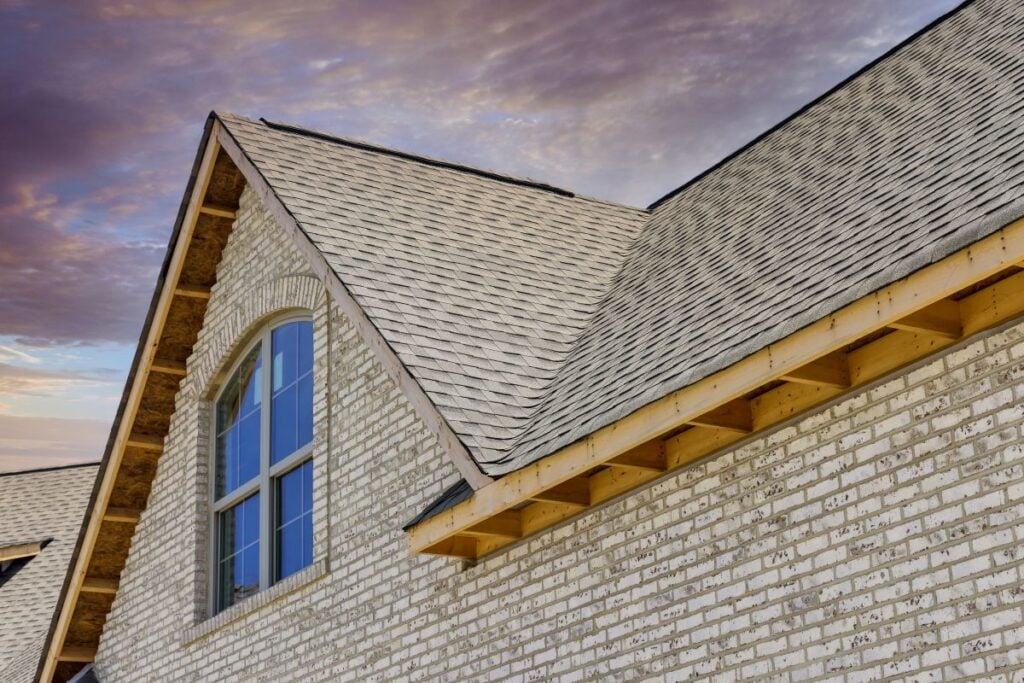 cost of metal roof vs shingle big house white brick walls
