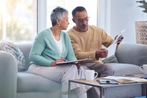 what to do if insurance denied roof claim old couple reviewing papers