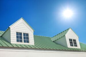 dormer roof metallic green roof blue sky sun shining