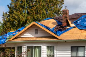 emergency roof repair tarp removed from shingles roof