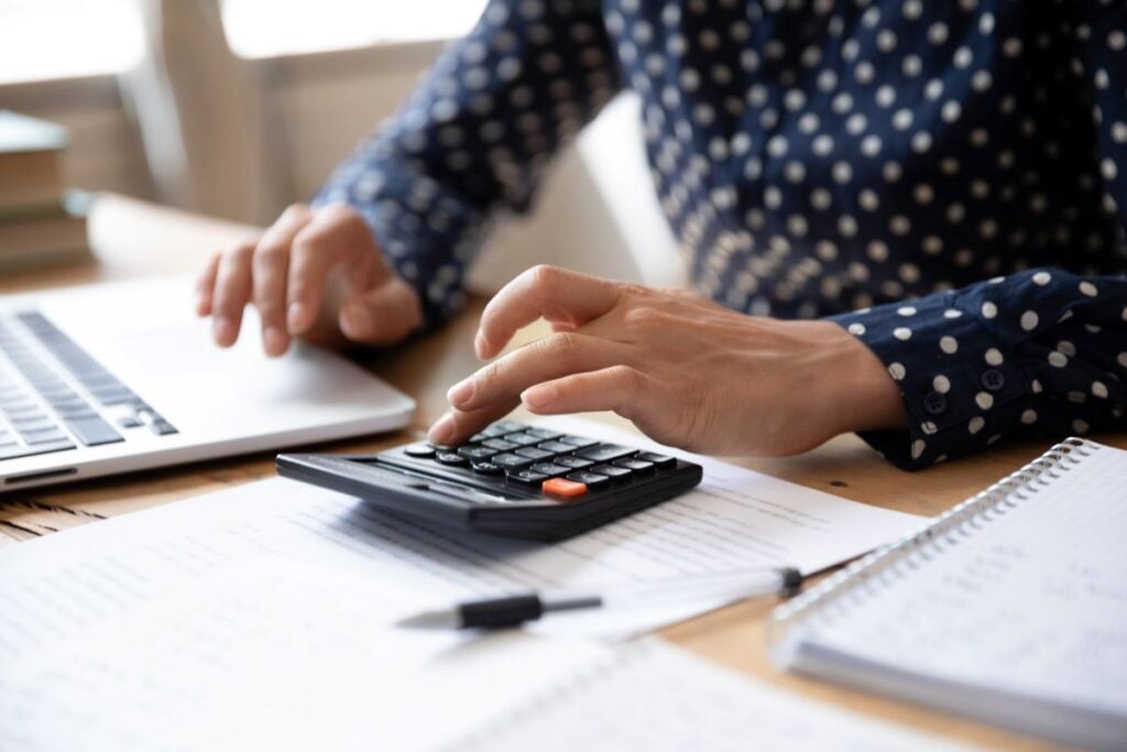 guy calculating roof insurance costs